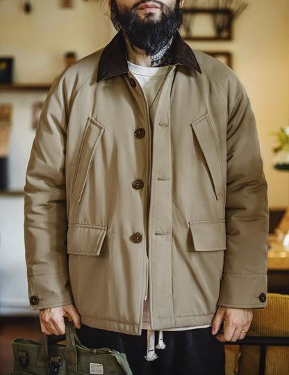 Man wearing khaki safari workwear jacket with corduroy collar