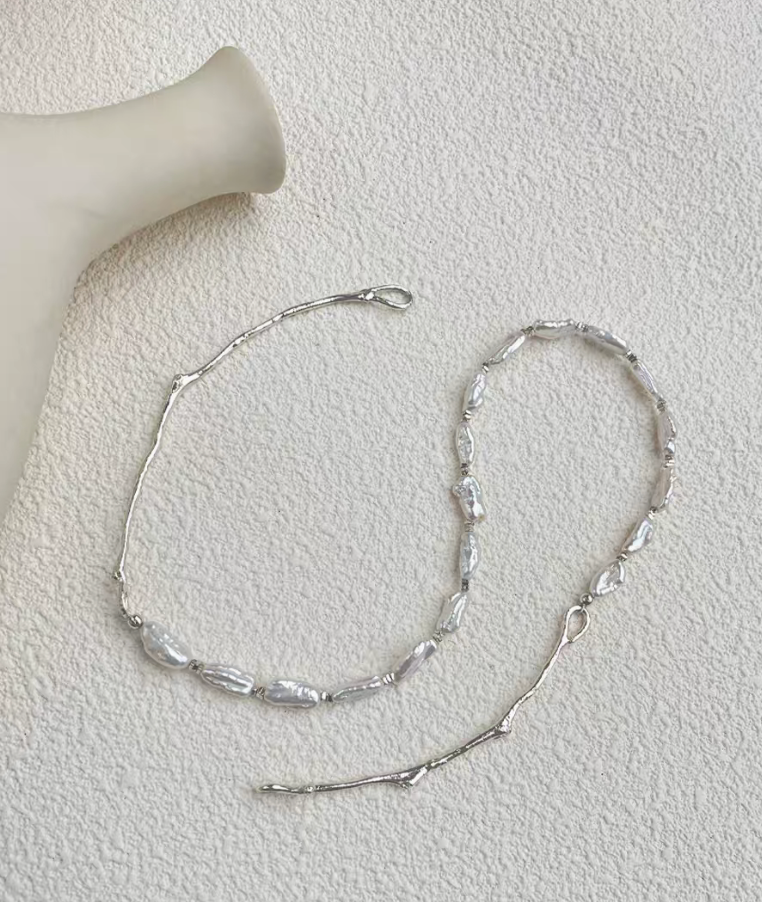 Nature’s Grace baroque pearl branch necklace laid open showing clasp, silver branch chain, and baroque pearl segment