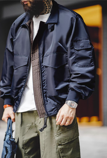 Outdoor look featuring G-8 Navy Flight Jacket styled with green cargo pants and white shirt.