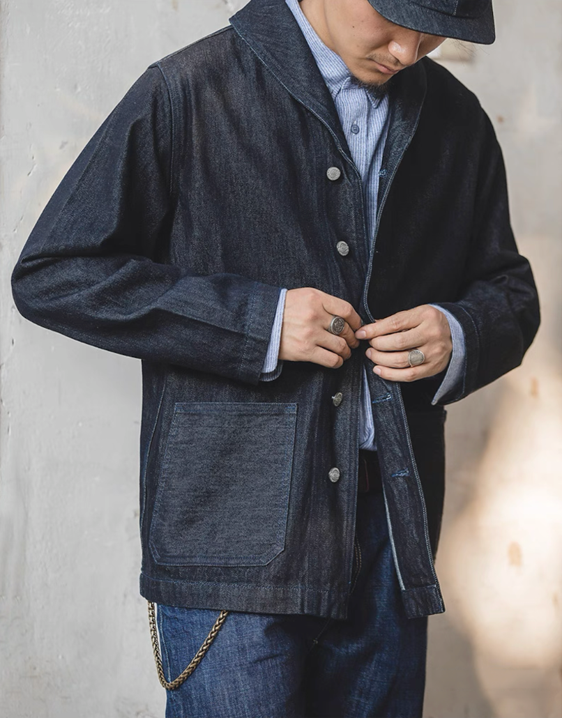 Model buttoning up Heritage Shawl-Collar Denim Jacket for men