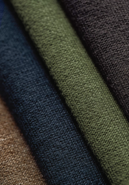 Close-up of heavyweight knit fabric in army green cotton blend