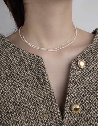 Model wearing rice pearl necklace with 14K gold-filled accents featuring both Style A and Style B layered together