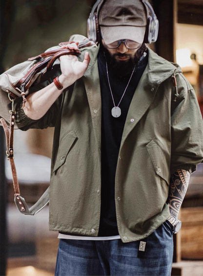 Man wearing Simple M-51 Cotton Jacket with jeans and headphones