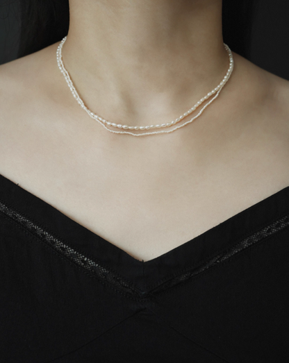 Model wearing wild pearl silver choker styled in double layered look with ultra-fine freshwater pearls for a minimalist elegant appearance