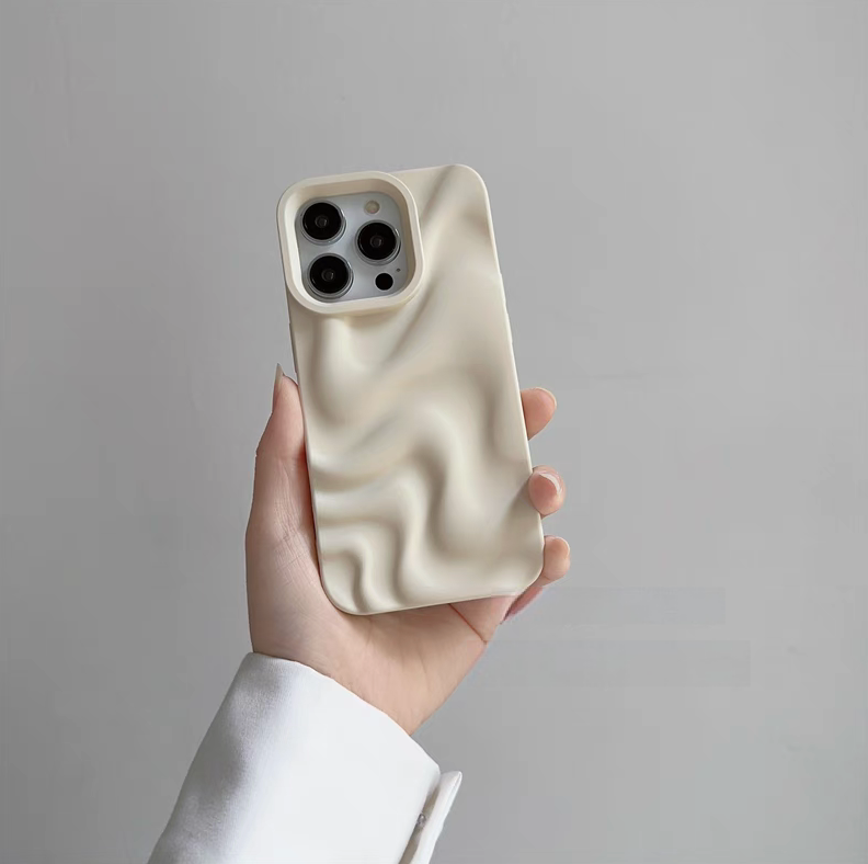 White 3D wave matte silicone phone case held in hand showing smooth wave texture and raised camera protection