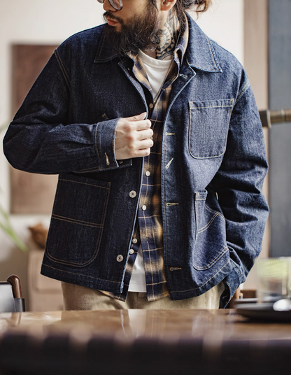 Men’s denim work coat styled open over check flannel shirt