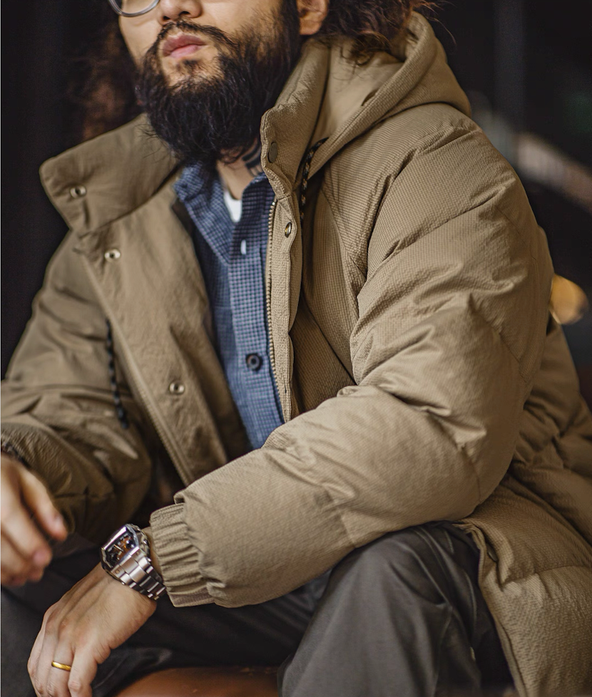 Close-up of khaki Urban Shield Jacket texture and quilting details