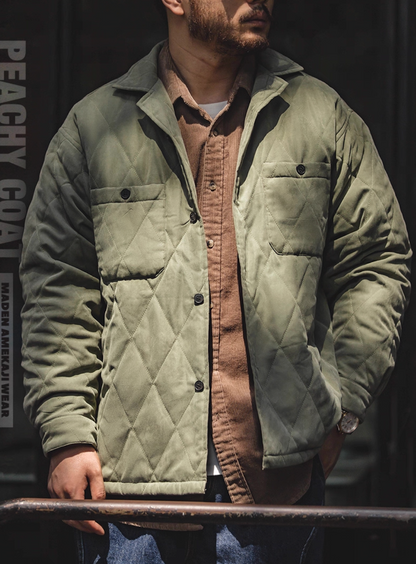 Sunlit outdoor photo of army green quilted peach-skin jacket
