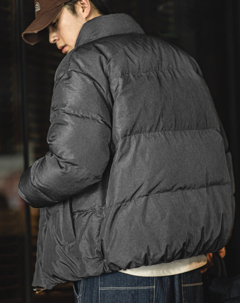 Back view of grey Dual-Tone Down Jacket showing heathered texture and fit