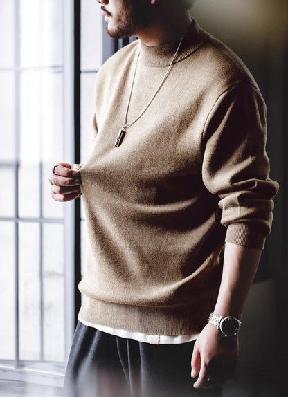 Model wearing sand beige half-turtleneck sweater with neutral outfit