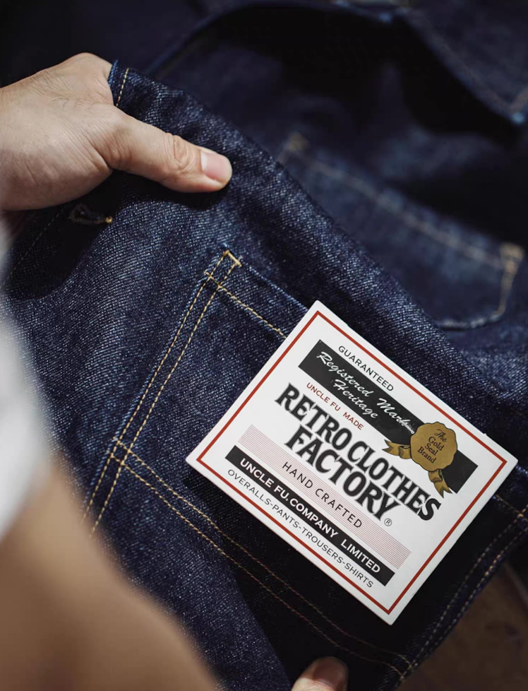 Close-up of Retro Clothes Factory label on Denim 4-Pockets Work Coat