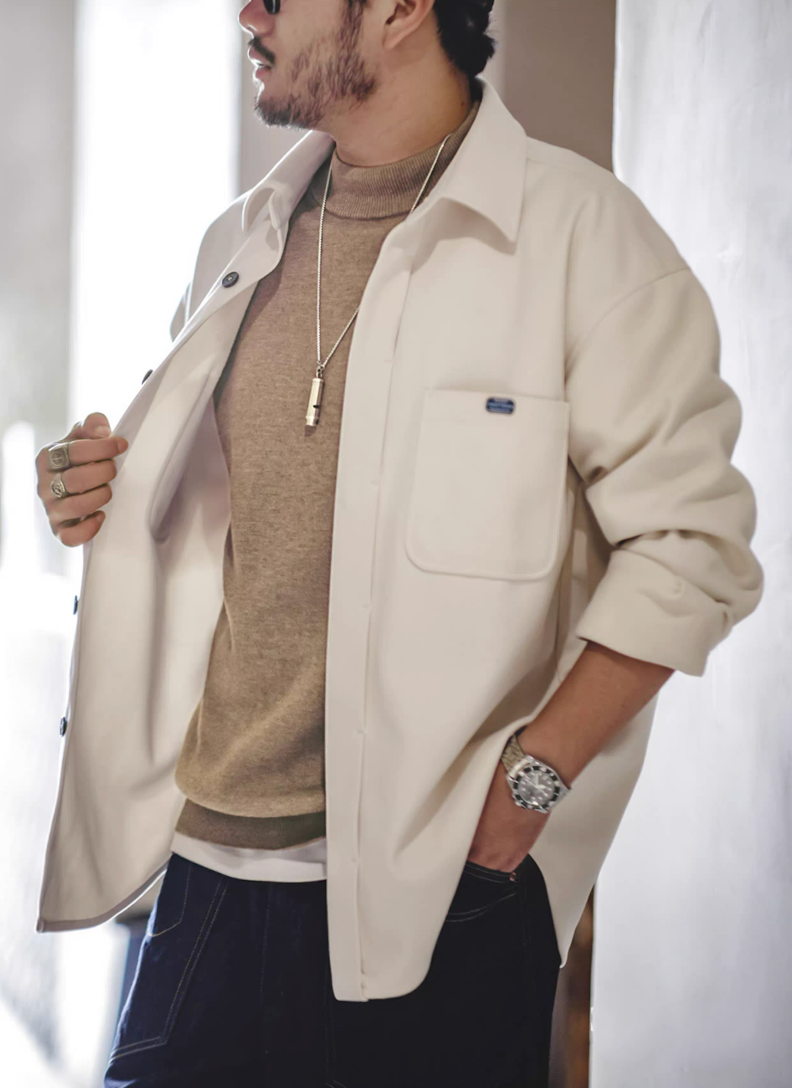 Sand beige sweater styled with white overshirt for fall layering