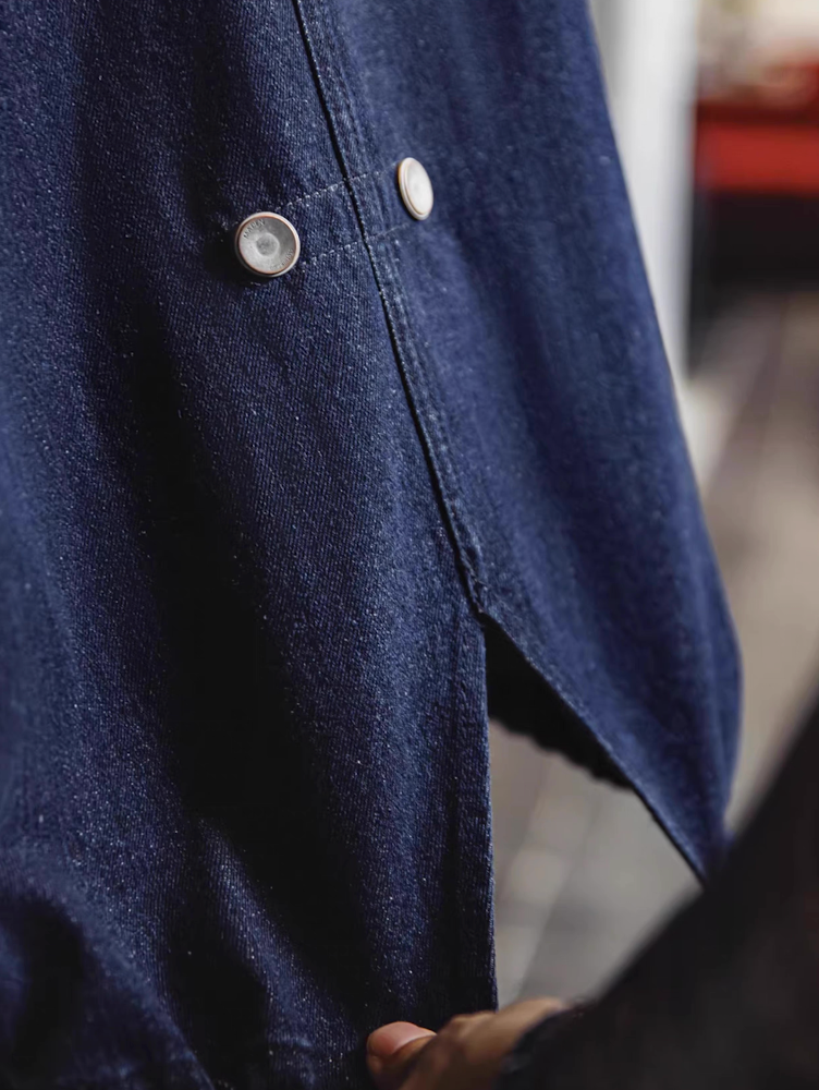 Snap button detail showing fishtail back of denim parka