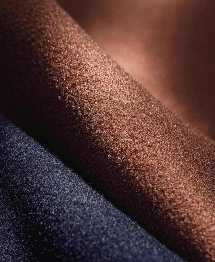 Macro shot of wool-look polyester fabric in brown and navy colors