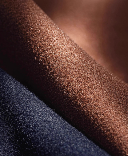 Macro shot of wool-look polyester fabric in brown and navy colors