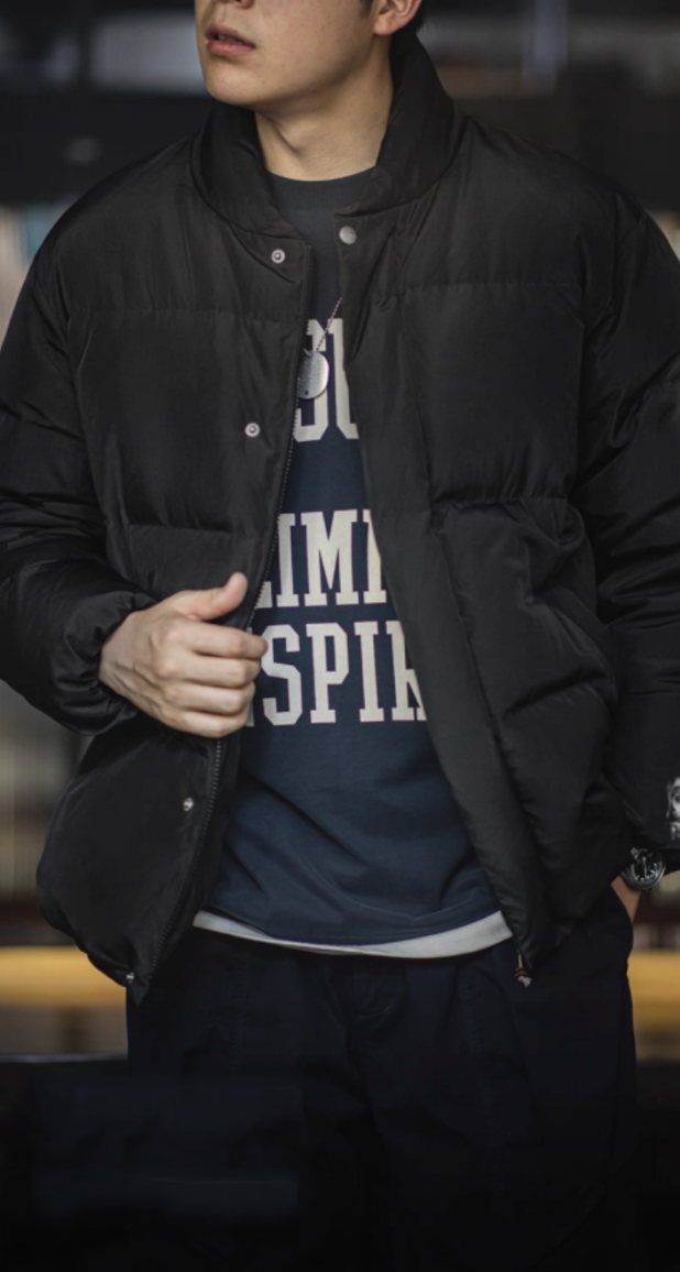 Model wearing black Dual-Tone Down Jacket with crewneck sweatshirt
