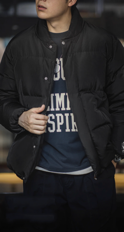 Model wearing black Dual-Tone Down Jacket with crewneck sweatshirt