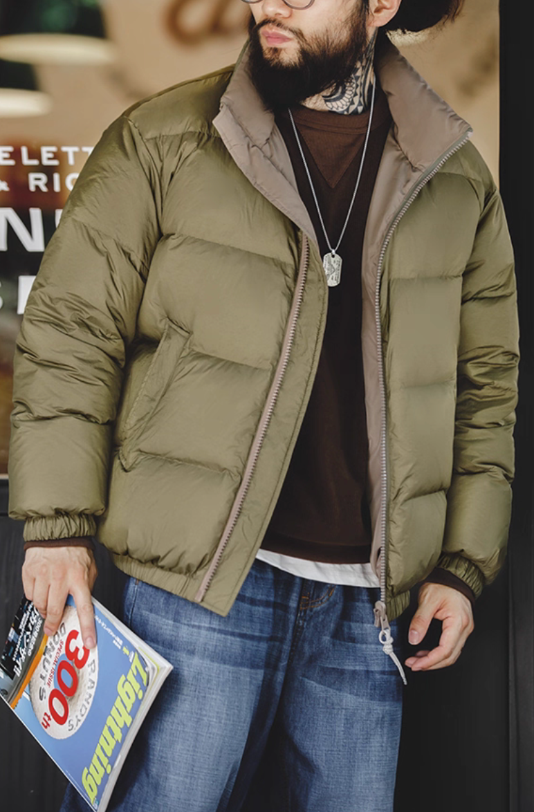 Model wearing army green Reversible Down Jacket styled with jeans and brown sweater