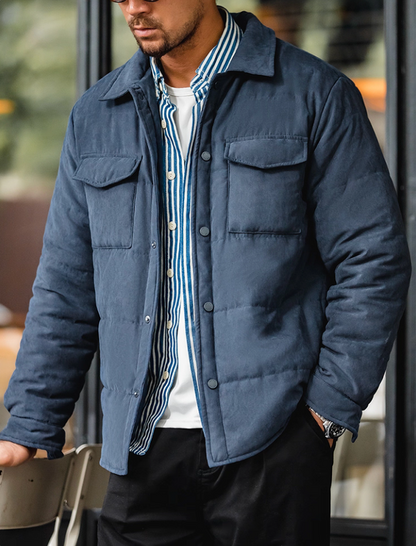 Model wearing Midnight Blue Softshell Puffer Overshirt over striped shirt