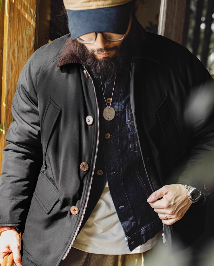 Black safari jacket layered with denim shirt and white tee outfit