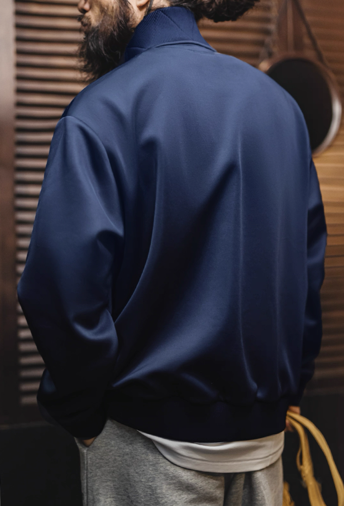 Back view of Riverdale Run navy track jacket with ribbed hem finish