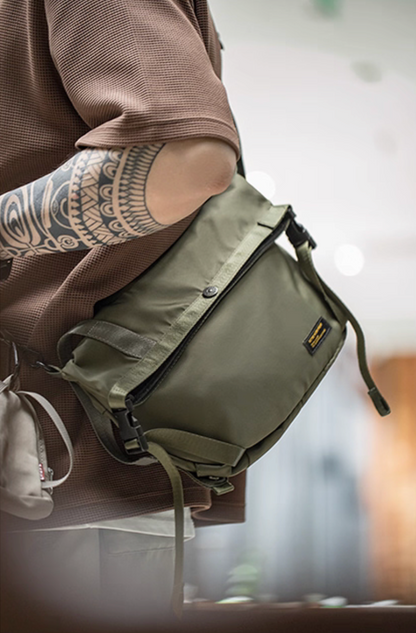 Model wearing olive Yama Style crossbody cycling bag across body