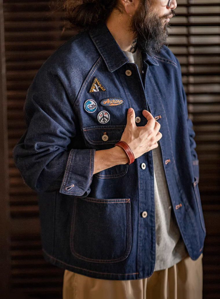 Side angle of model wearing heritage denim jacket
