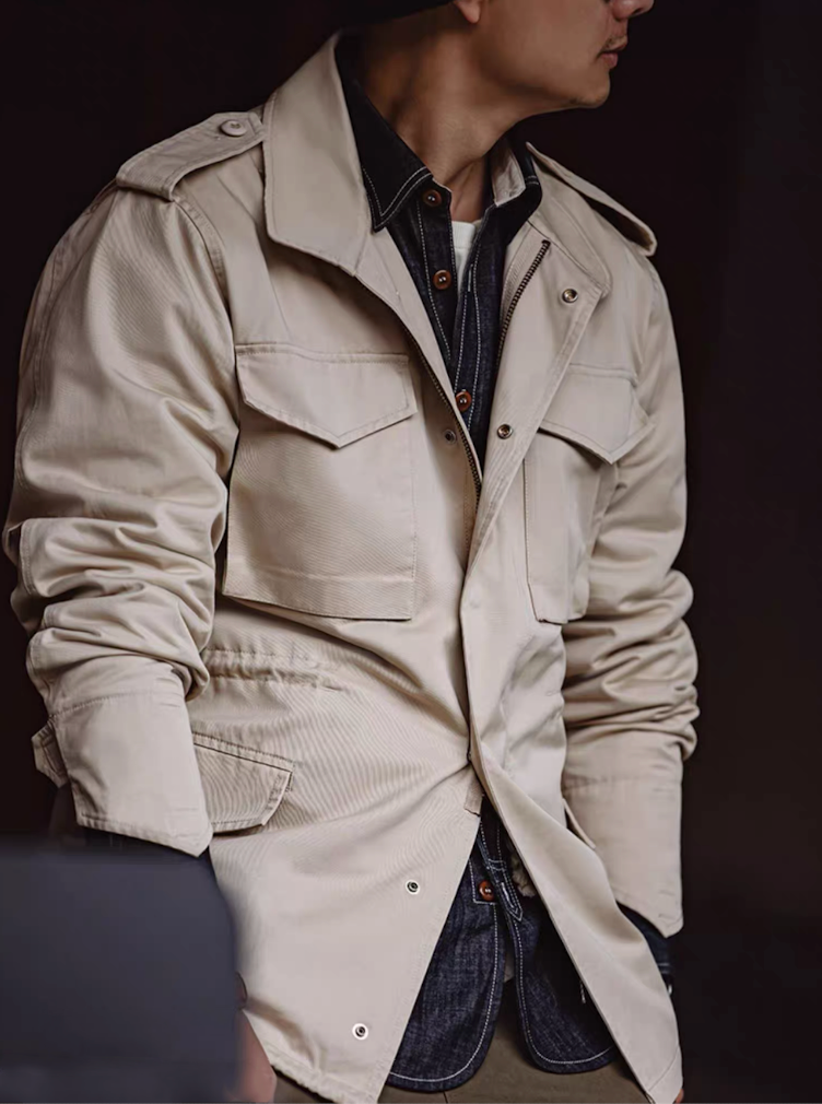 Side view of model wearing Heritage M65 Field Jacket in Sand Beige cotton