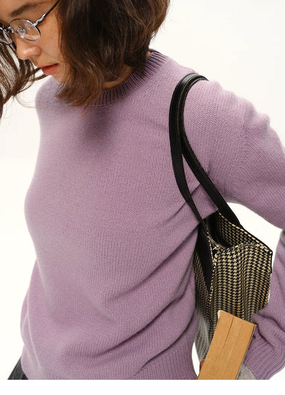 Close-up of lavender cashmere-blend sweater showing knit texture and shoulder details.