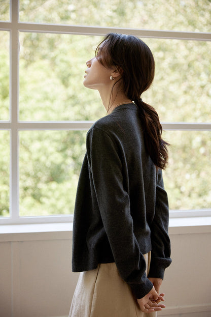 Full-length back view highlighting relaxed drape and cropped hem