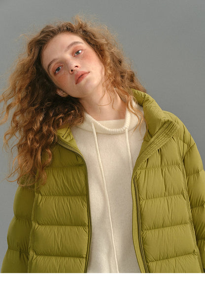 Close-up of mustard green matte down puffer showing stand collar details.