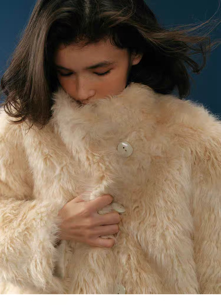 Close-up of long-pile plush texture and stand collar on Almond Aura Plush Coat