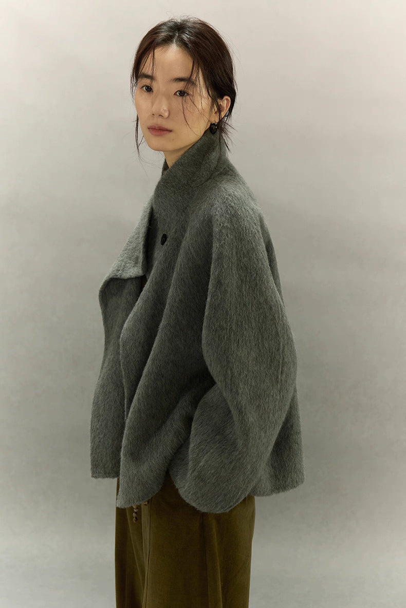 Side profile of sage gray alpaca sculpted-collar jacket with relaxed dropped shoulders
