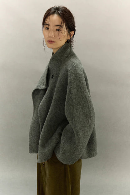 Side profile of sage gray alpaca sculpted-collar jacket with relaxed dropped shoulders