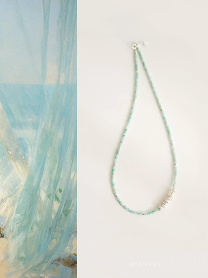Amazonite and Baroque pearl choker necklace with aqua beads and clustered pearl centerpiece on white background