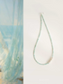 Amazonite and Baroque pearl choker necklace with aqua beads and clustered pearl centerpiece on white background