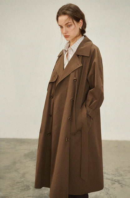Dark brown short trench coat front view with double breasted buttons and relaxed oversized fit