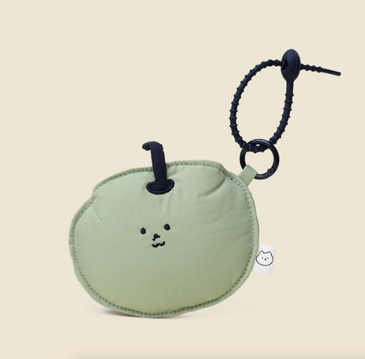 Green apple face zip pouch keychain, lightweight and giftable.