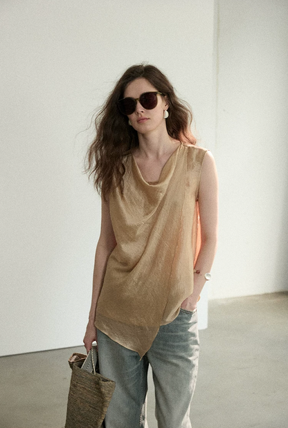 Waist-up front view of Apricot draped cowl neck sleeveless top