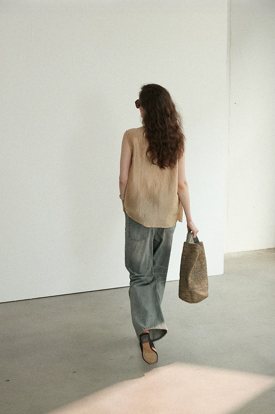 Back view of Apricot sleeveless draped top showing relaxed straight fit