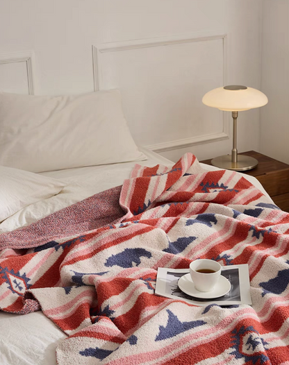 Detailed view of Red Embroidered Bear blanket texture with visible stitching and soft fleece surface