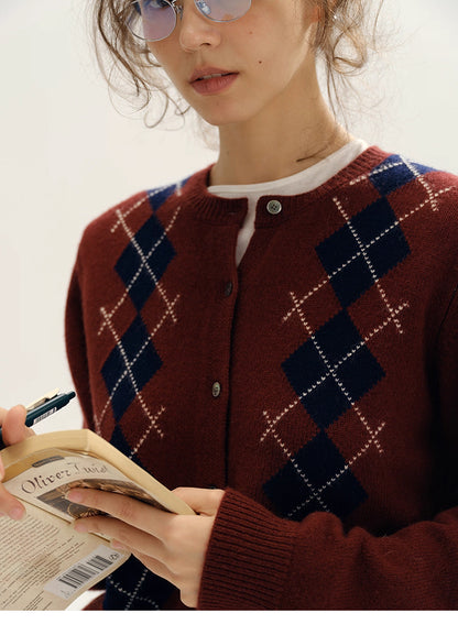 close-up of wine red argyle wool cardigan pattern near neckline
