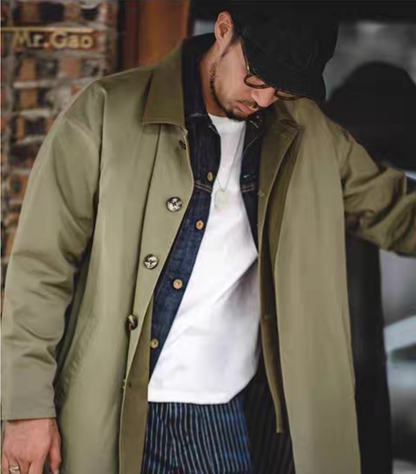 Model styling men’s army green coat with denim