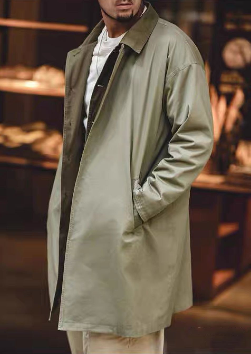 Urban casual outfit with army green mid-length coat