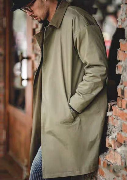 Side profile of men’s army green coat