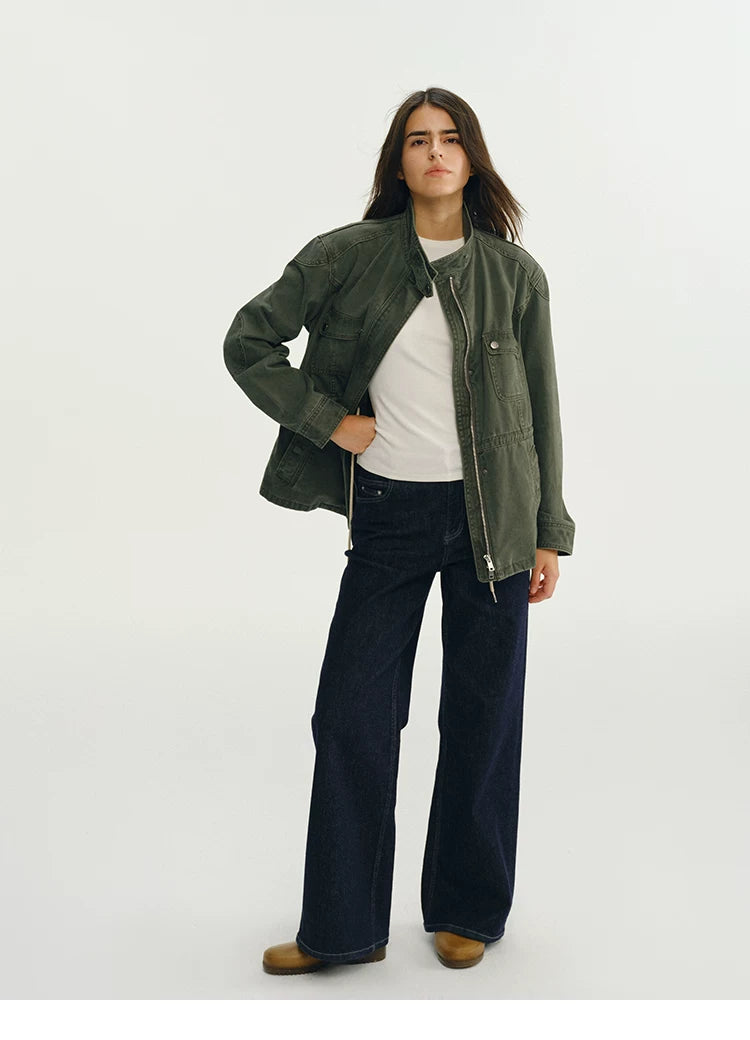 Full-length view of an army green cotton field jacket worn open with a stand collar