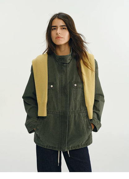 Army green field jacket with stand collar, flap chest pockets, and lower pockets