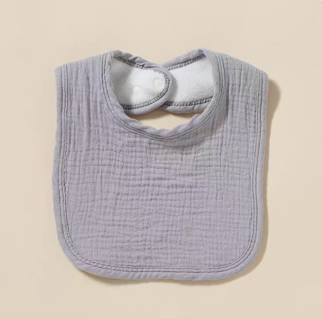 Gray baby cotton gauze bib with soft breathable fabric and snap closure