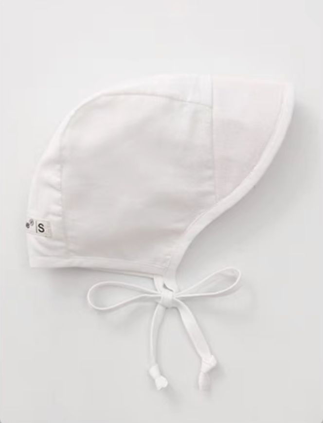 Light cream baby linen cotton sun hat side view with clean minimal soft neutral tone