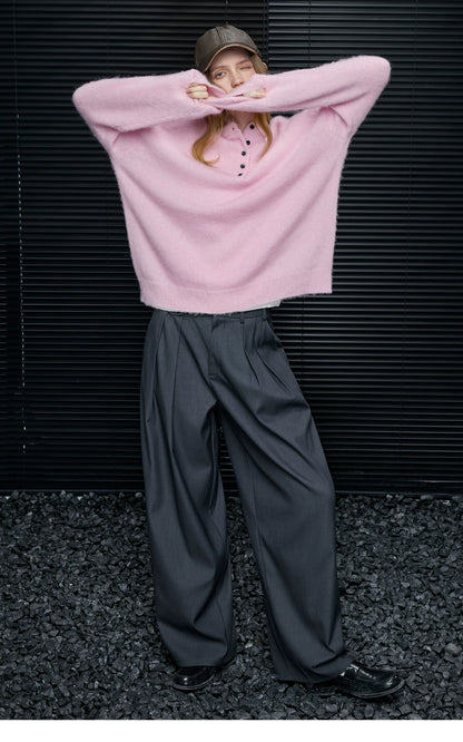 Full-length look of Baby Pink alpaca-wool Henley sweater with a brown leather cap and black loafers